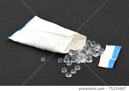 Polymer pellets. Pile of silica gel. Polymer pellets. Pile of silica gel. 75235667