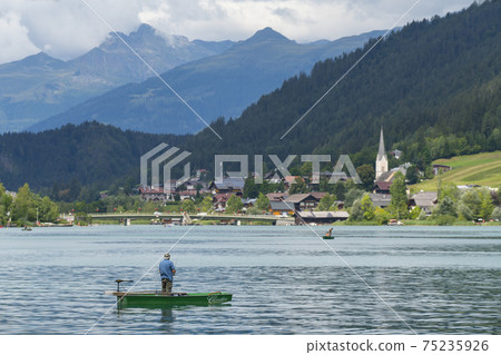 The fisherman on the lake The fisherman on the lake 75235926