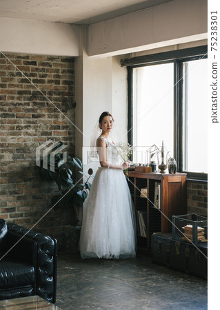 Portrait of a bride in a wedding dress Portrait of a bride in a wedding dress 75238301