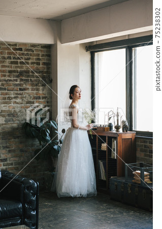 Portrait of a bride in a wedding dress Portrait of a bride in a wedding dress 75238302