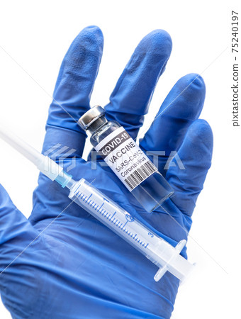 COVID-19 coronavirus vaccine in doctor hand isolated on white, bottle and syringe in gloved palm COVID-19 coronavirus vaccine in doctor hand isolated on white, bottle and syringe in gloved palm 75240197