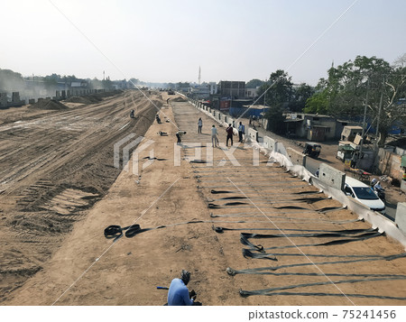 Men working with iron rods at the construction site of bridge, Bhusawal, India, feb 2021 Men working with iron rods at the construction site of bridge, Bhusawal, India, feb 2021 75241456