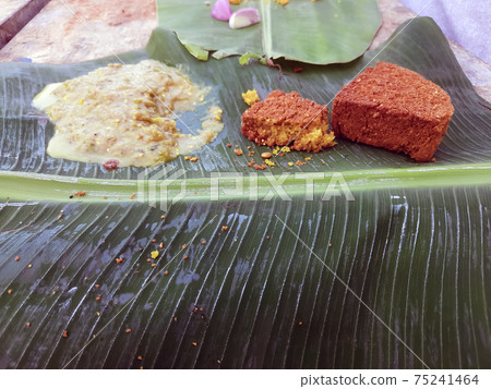 Daal Baati Churma is a popular Healthy food from Rajasthan, India. Served antique Brass plate and bowl over moody background. Daal Baati Churma is a popular Healthy food from Rajasthan, India. Served antique Brass plate and bowl over moody background. 75241464