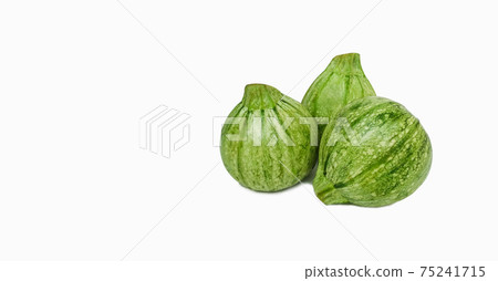 green zucchini of round shape on white background with copy space green zucchini of round shape on white background with copy space 75241715