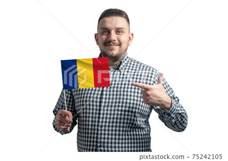 White guy holding a flag of Romania and points the finger of the other hand at the flag isolated on a white background White guy holding a flag of Romania and points the finger of the other hand at the flag isolated on a white background 75242105