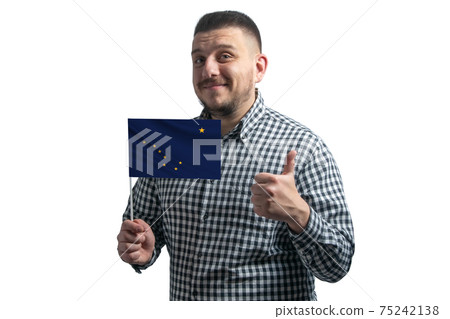 White guy holding a flag of Alaska and shows the class by hand isolated on a white background. Like for Alaska White guy holding a flag of Alaska and shows the class by hand isolated on a white background. Like for Alaska 75242138