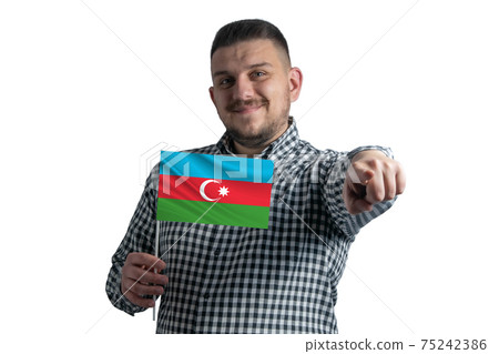 White guy holding a flag of Azerbaijan and points forward in front of him isolated on a white background 75242386