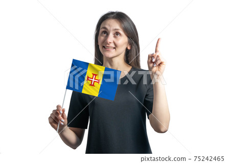 Happy young white woman holding flag of Madeira and points thumbs up isolated on a white background 75242465
