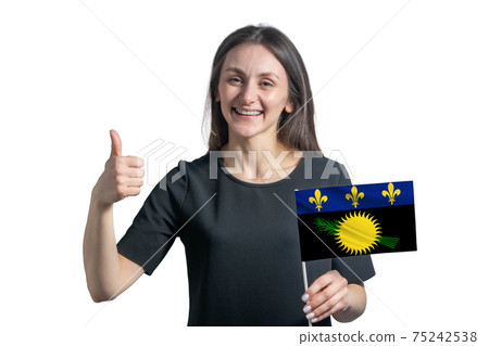 Happy young white woman holding flag of Guadeloupe and shows the class by hand isolated on a white background Happy young white woman holding flag of Guadeloupe and shows the class by hand isolated on a white background 75242538