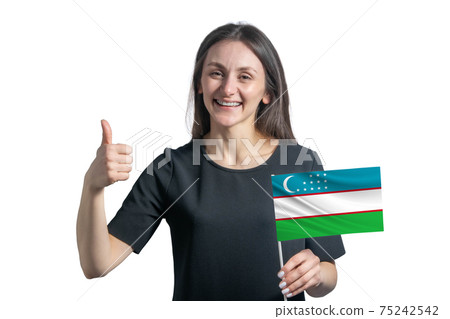 Happy young white woman holding flag of Uzbekistan and shows the class by hand isolated on a white background Happy young white woman holding flag of Uzbekistan and shows the class by hand isolated on a white background 75242542