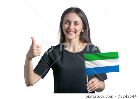 Happy young white woman holding flag of Sierra Leone and shows the class by hand isolated on a white background Happy young white woman holding flag of Sierra Leone and shows the class by hand isolated on a white background 75242544