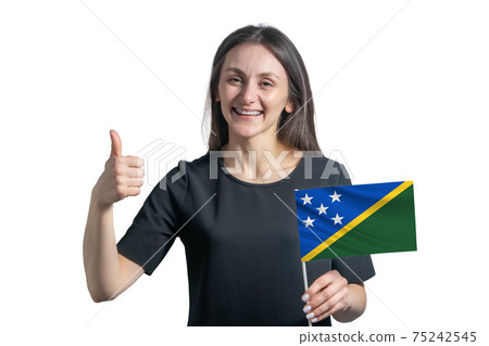 Happy young white woman holding flag of Solomon Islands and shows the class by hand isolated on a white background Happy young white woman holding flag of Solomon Islands and shows the class by hand isolated on a white background 75242545