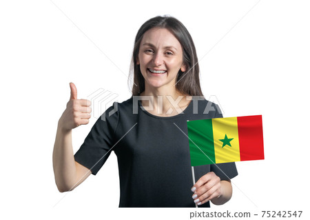Happy young white woman holding flag of Senegal and shows the class by hand isolated on a white background 75242547