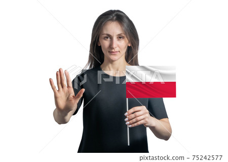 Happy young white woman holding flag of Poland and with a serious face shows a hand stop sign isolated on a white background Happy young white woman holding flag of Poland and with a serious face shows a hand stop sign isolated on a white background 75242577