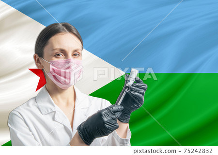Girl doctor prepares vaccination against the background of the Djibouti flag. Vaccination concept Djibouti Girl doctor prepares vaccination against the background of the Djibouti flag. Vaccination concept Djibouti 75242832