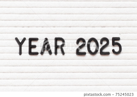 Black color letter in word year 2025 on white felt board background 75245023