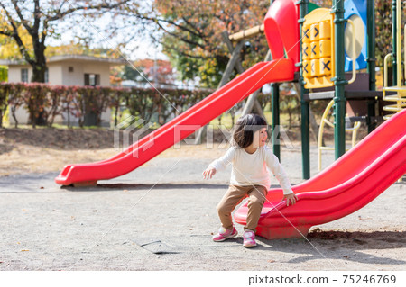 Children playing on the slide 75246769