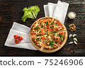Delicious pizza on a wooden cutting board 75246906