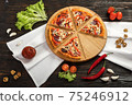 Delicious pizza on a wooden cutting board 75246912