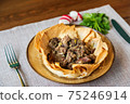 Appetizing meat in baked lavash according 75246914