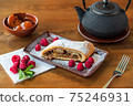 A piece of tender crispy strudel with apples 75246931