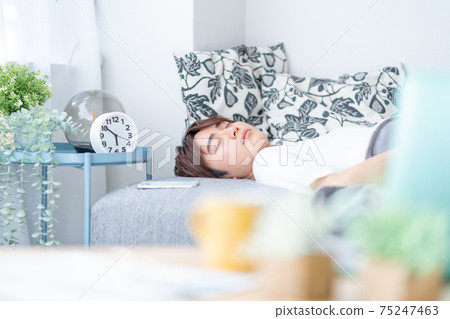 A young man sleeping early in the morning A young man sleeping early in the morning 75247463