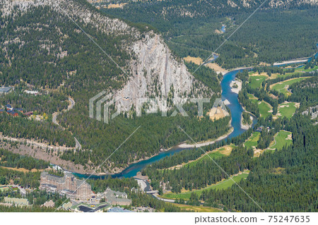 Aerial view of Banff Springs Golf Course and Tunnel Mountain, Bow River and Spray River valleys in summer time. Banff National Park, Canadian Rockies, Alberta, Canada. 75247635