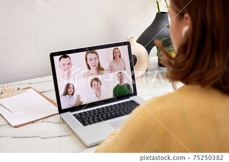Woman speak using Webcam conference on laptop Woman speak using Webcam conference on laptop 75250382