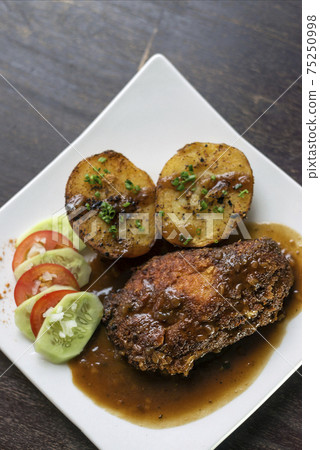 cordon bleu breaded fried chicken gravy and potatoes meal cordon bleu breaded fried chicken gravy and potatoes meal 75250998