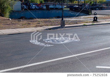 Route 66 sign written on the road 75252816