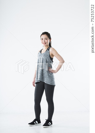 Young women sportswear white background looking at the camera 75253722