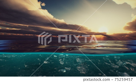 Split view over and under water in the Caribbean sea with clouds Split view over and under water in the Caribbean sea with clouds 75259457