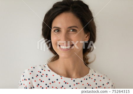 Closeup portrait of happy smiling young lady with beautiful hairdo Closeup portrait of happy smiling young lady with beautiful hairdo 75264315