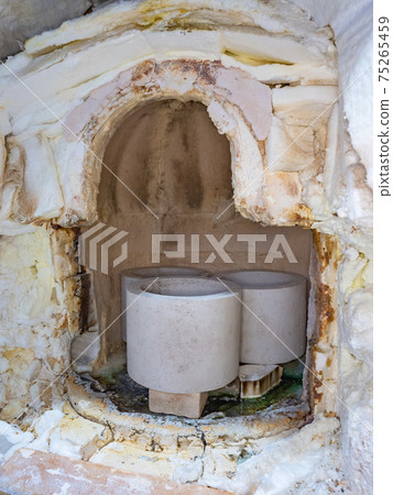 Cold kiln in a glassworks. Fireclay glass blowing oven or furnace Cold kiln in a glassworks. Fireclay glass blowing oven or furnace 75265459