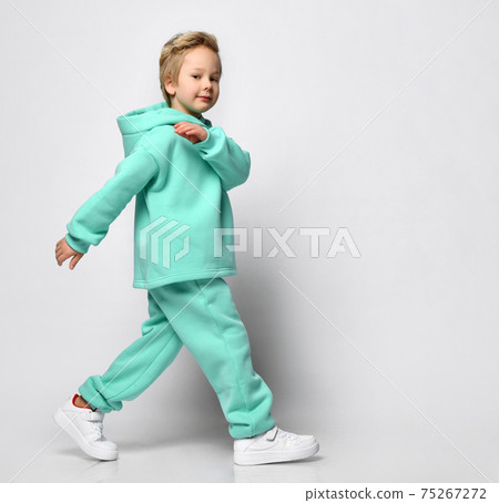 Portrait of a little stylish boy in a warm sports 75267272