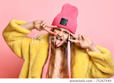 Close up portrait of teen girl who showing double Close up portrait of teen girl who showing double 75267449