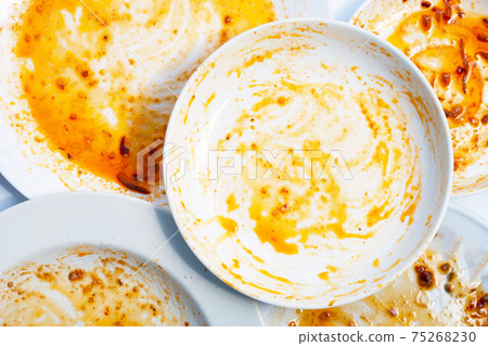 Dirty dishes on white background. Top view 75268230