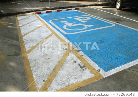 disabled parking permit sign painted on the street disabled parking permit sign painted on the street 75269148