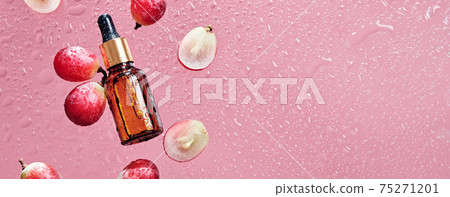 Organic cosmetics with grape seed oil and herbal ingredients. Zero Waste Winemaking. Skincare product bottle, grapes and water drops, banner format Organic cosmetics with grape seed oil and herbal ingredients. Zero Waste Winemaking. Skincare product bottle, grapes and water drops, banner format 75271201