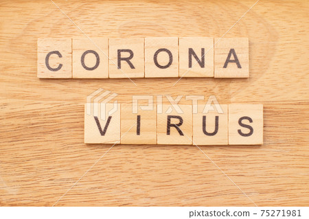 Word Corona Virus made from wooden letters on desk. Coronavirus concept. Word Corona Virus made from wooden letters on desk. Coronavirus concept. 75271981