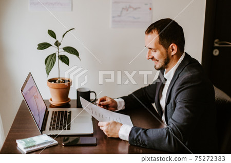 happy financial manager stock graph price trend analysing 75272383