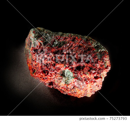 Garnet almandine stone crystal inside rock. A mineral isolated on black. Found near Miass city, Ural, Russia. Geology mineralogy websites, stone collection catalog, Natural Science museum wall chart. 75273793
