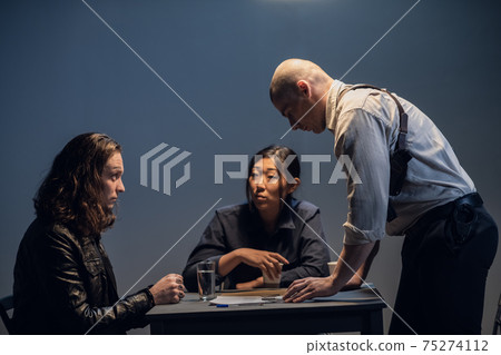 An experienced investigator conduct an interview at the police station An experienced investigator conduct an interview at the police station 75274112