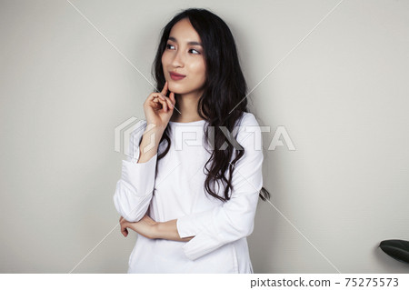 young asian woman doctor in white uniform gesturing positive on gray background, lifestyle healthcare people concept young asian woman doctor in white uniform gesturing positive on gray background, lifestyle healthcare people concept 75275573