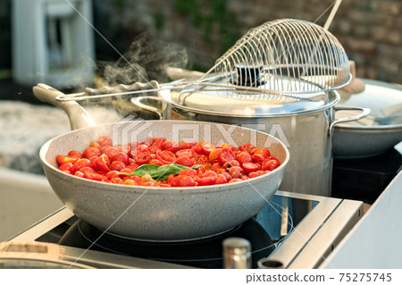 Cherry tomatoes on a saucepan Cherry tomatoes on a saucepan 75275745