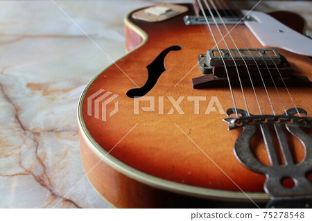 Old electric acoustic guitar Old electric acoustic guitar 75278548
