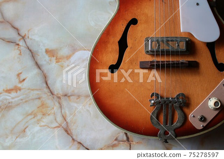 Old electric acoustic guitar 75278597