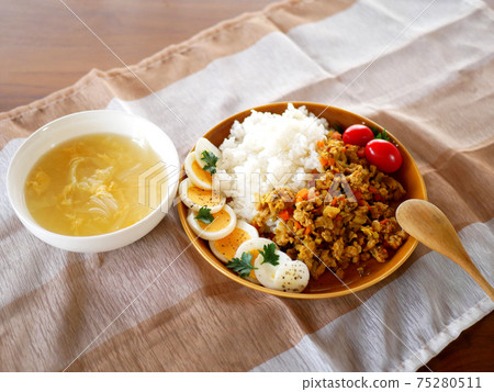 Lunch of dry curry and soup on the table Lunch of dry curry and soup on the table 75280511