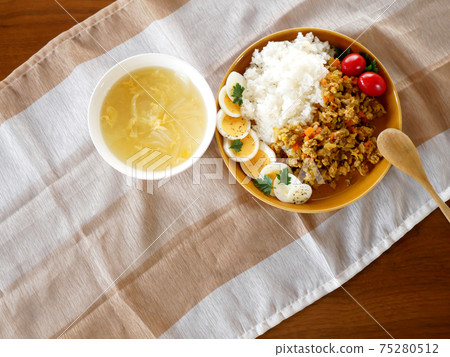 Lunch of dry curry and soup on the table Lunch of dry curry and soup on the table 75280512