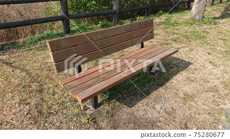 Bench in a sunny park in good season Bench in a sunny park in good season 75280677